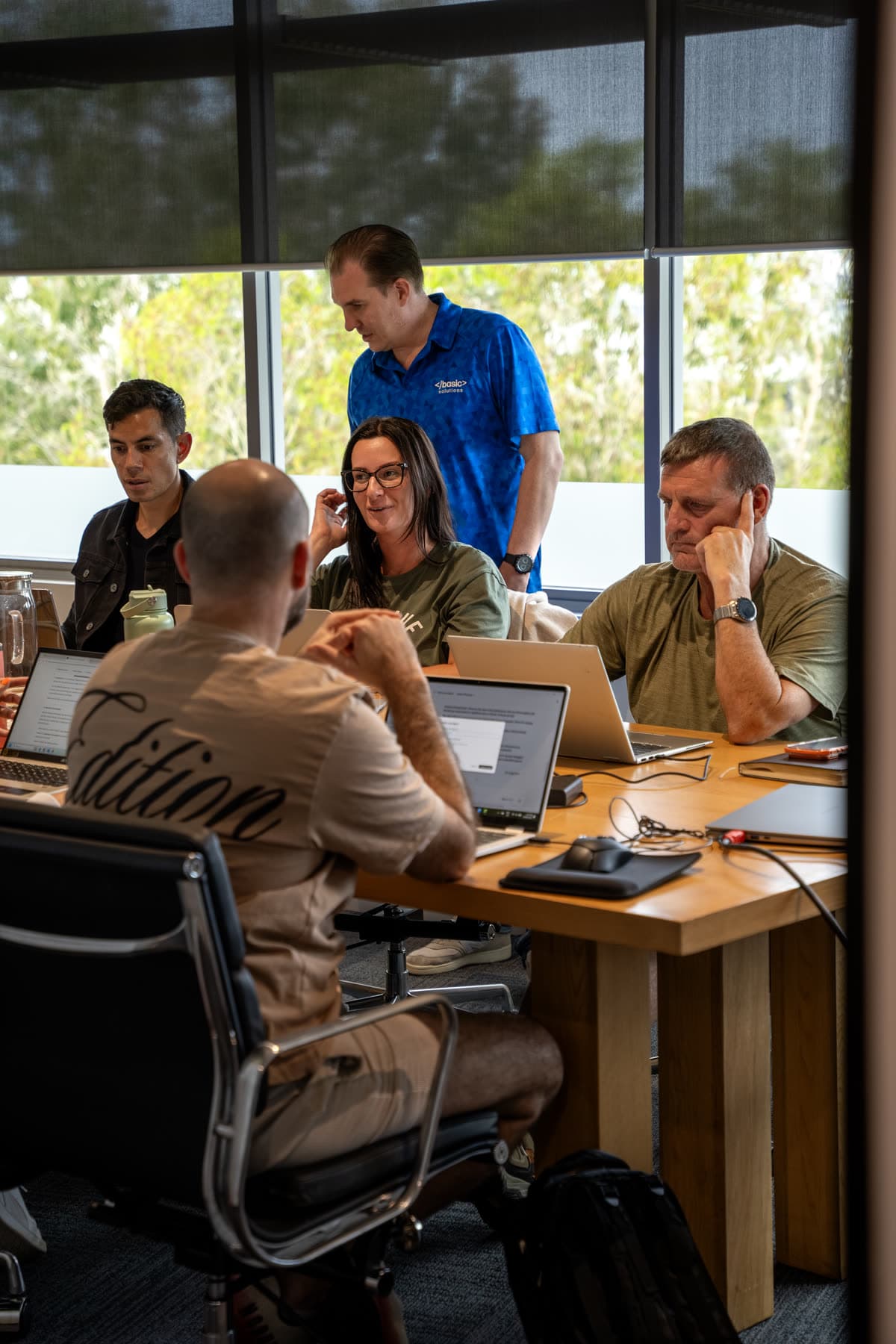 Business owners building their own AI at a Basic Solutions workshop
