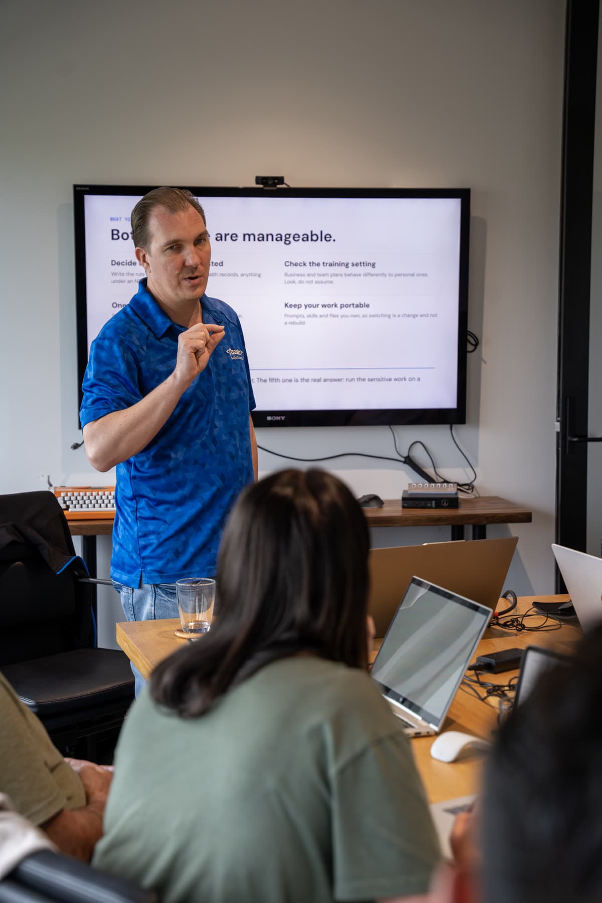 Business owners building their own AI at a Basic Solutions workshop